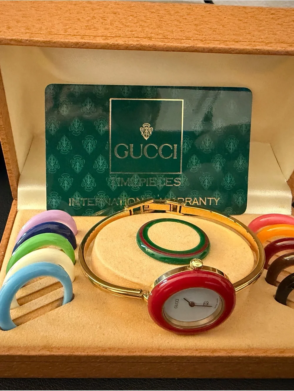 Gucci Gold Bangle Watch with Red Bezel and Interchangeable Color Bezels